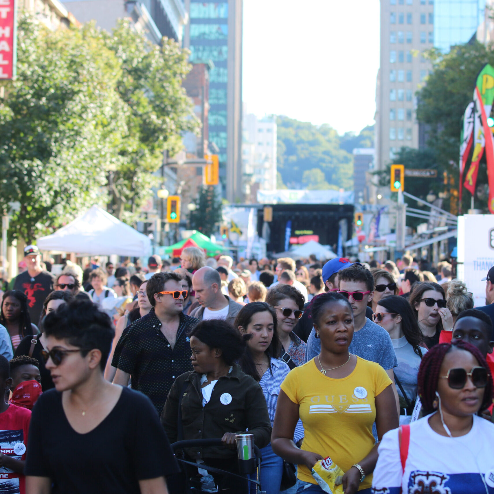 A large group of people walking towards the camera